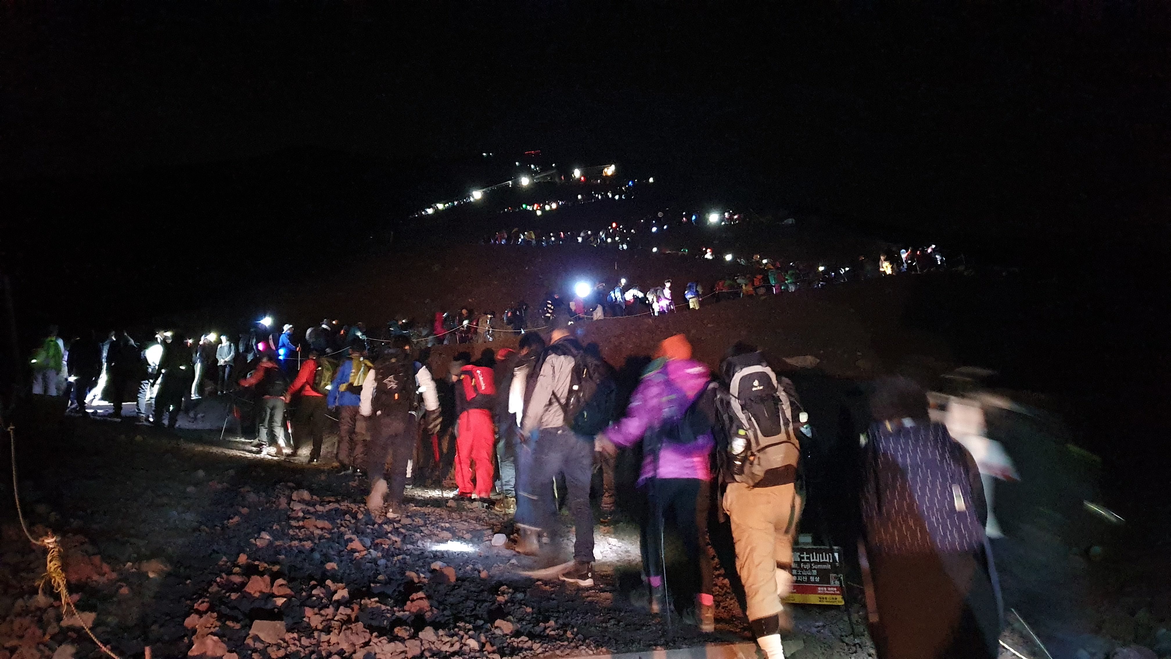 Line of climbers on Mt Fuji at night