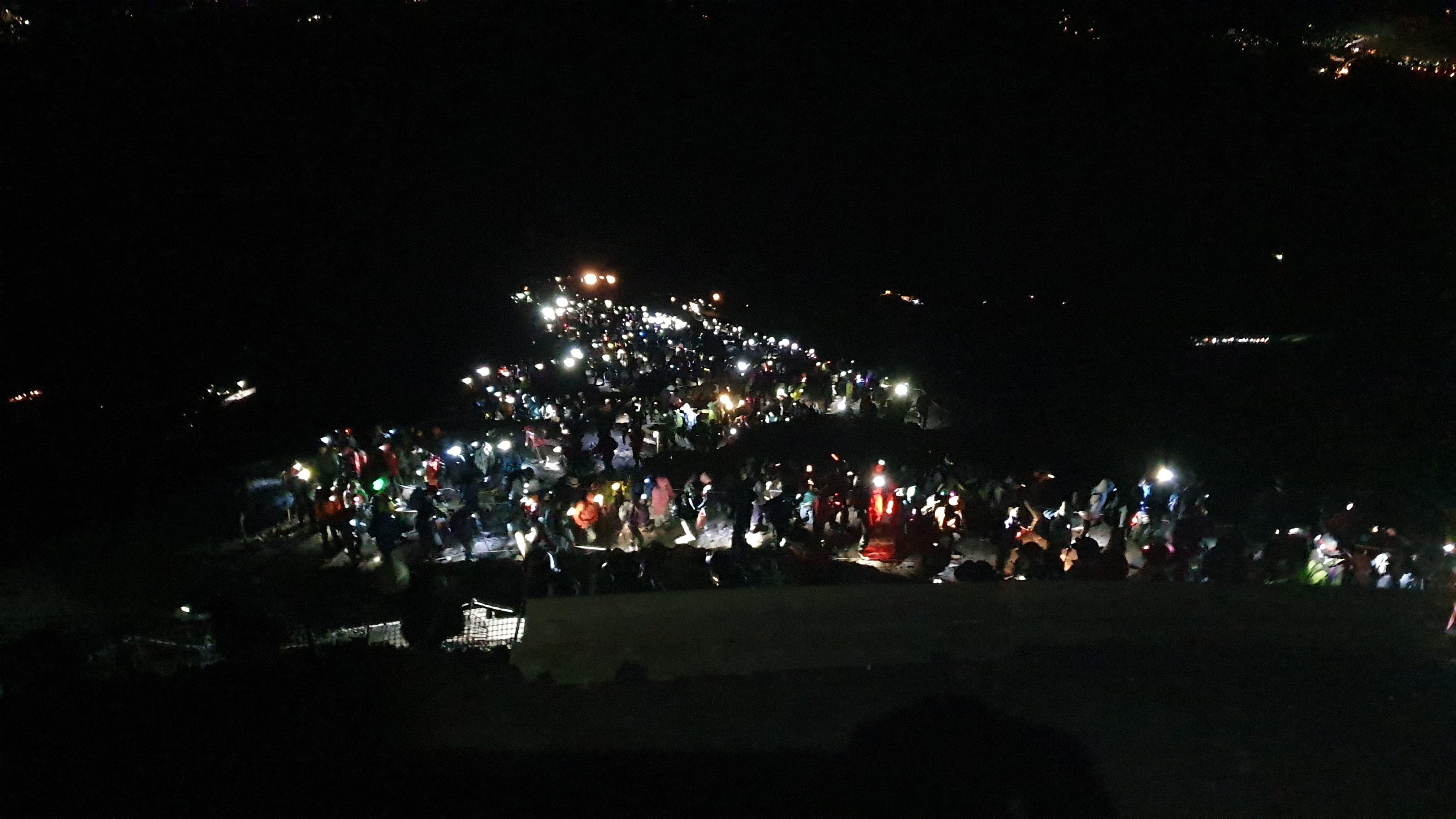 Line of people climbing Mt Fuji at night