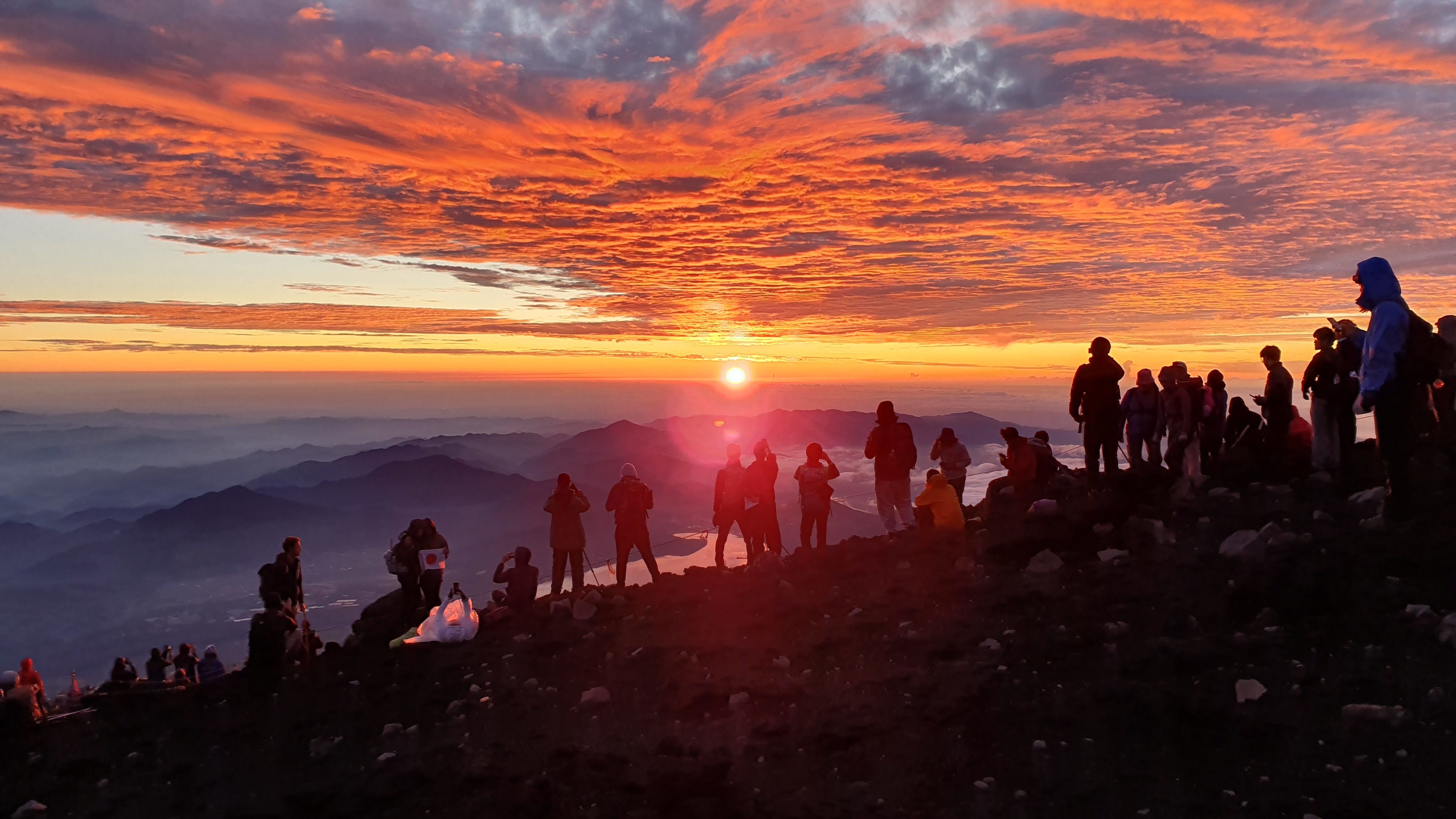 Climbers watching sunrise from Mt Fuji