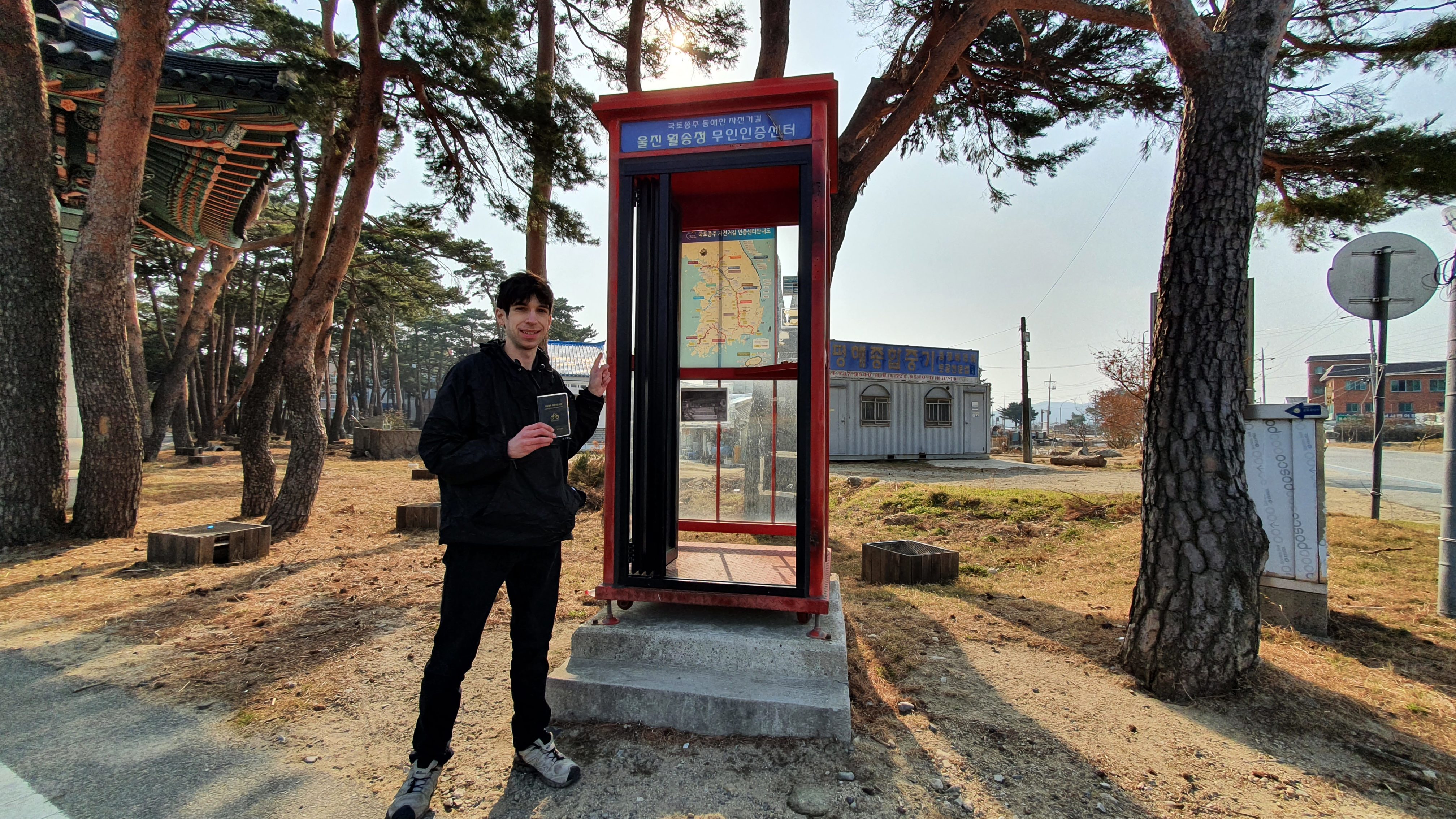 Man at stamp booth on Korea East Coast Bike Trail