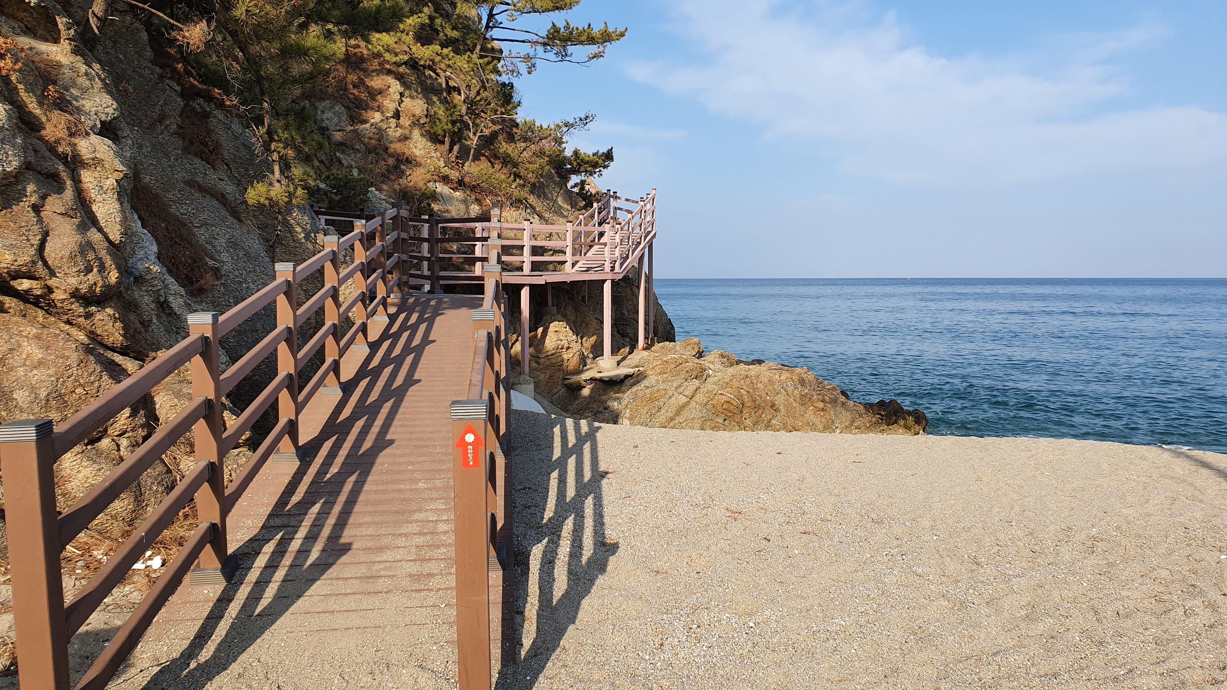 Walkway along cliff by ocean